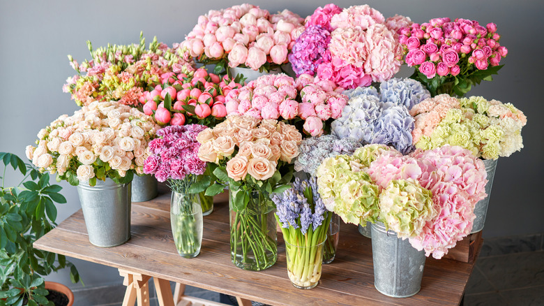 variety of flowers in vases