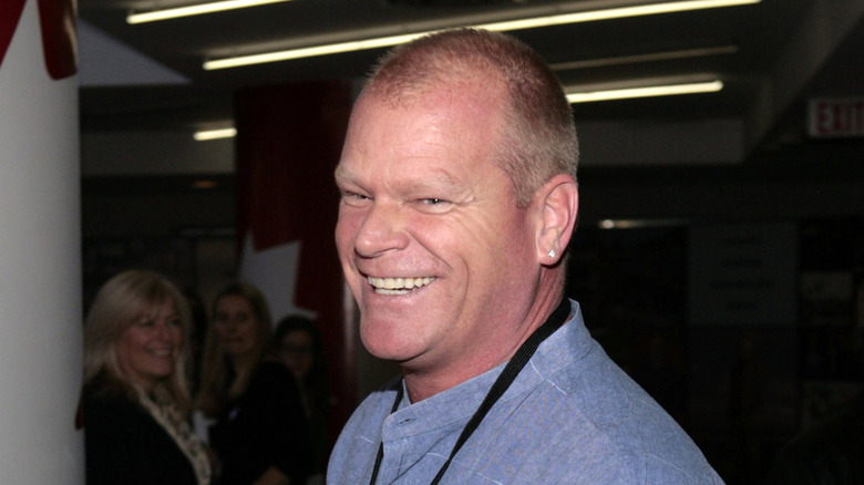 Mike Holmes smiling in a blue shirt