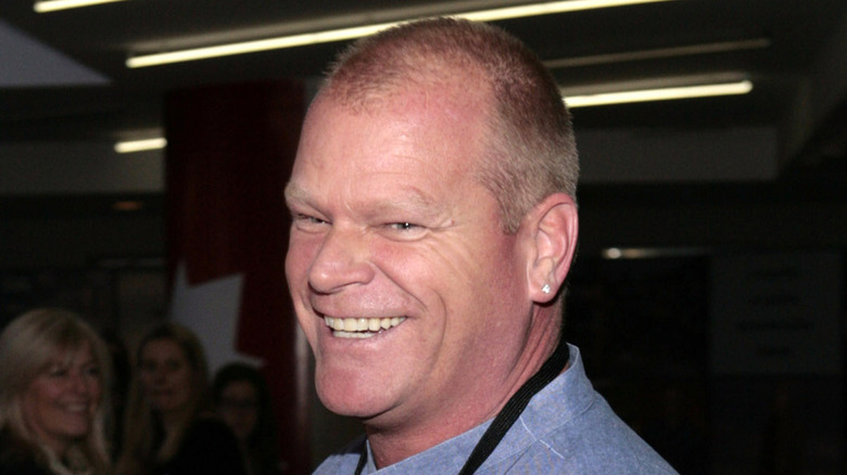 Mike Holmes smiling at a red carpet event