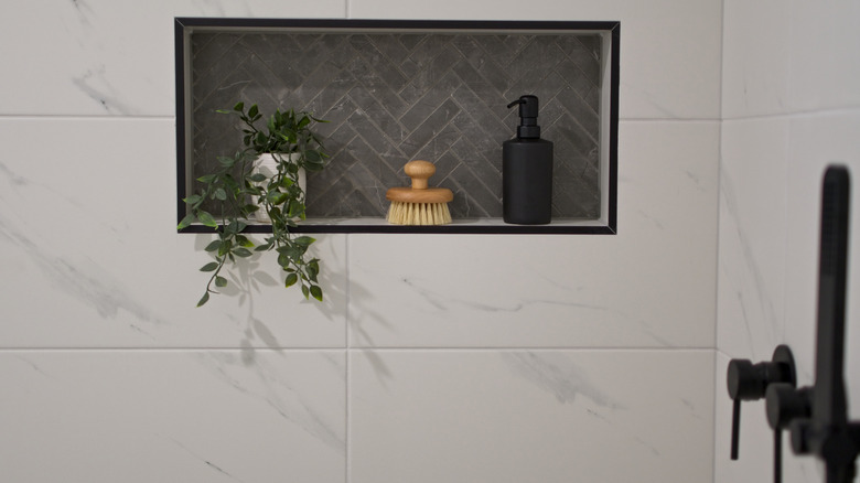 Tiled wall niche in modern bathroom