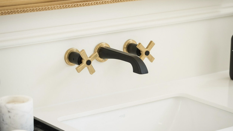 wall mounted black faucet