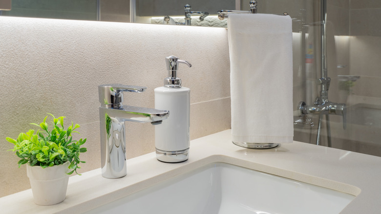 Horizontal photo close-up of a sink with modern decoration in a renovated bathroom