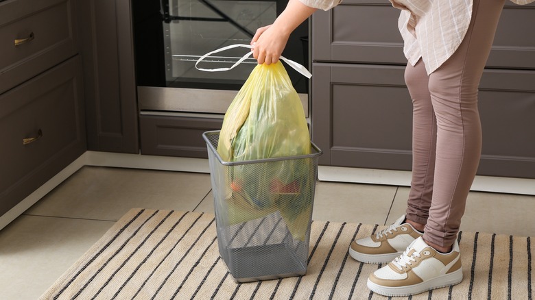 woman taking out trash