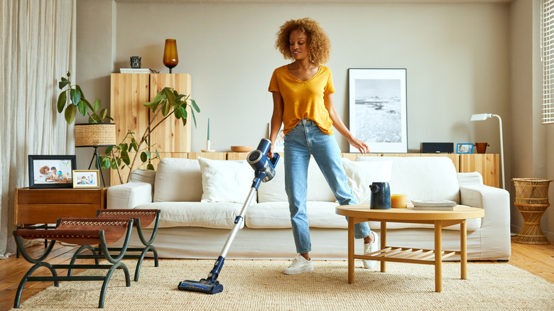 woman vacuuming living room