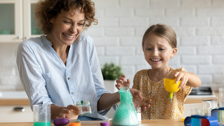 Parent and child with modern chemistry set