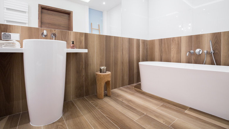 white bathroom with wood surround
