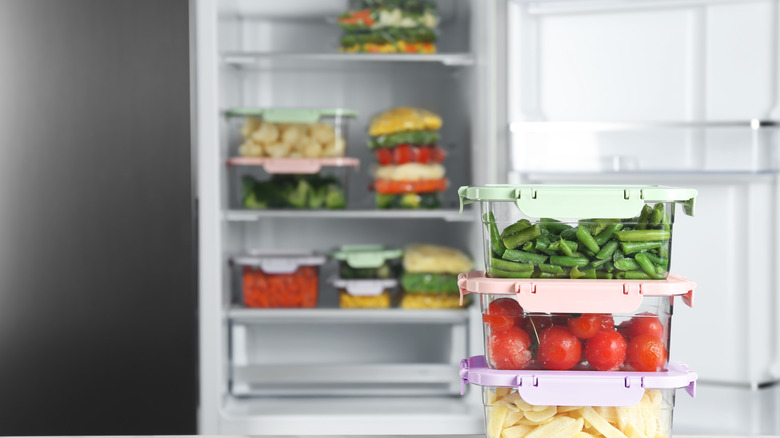 open freezer with frozen vegetables