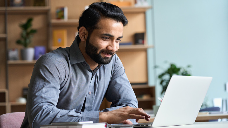 man on laptop in home