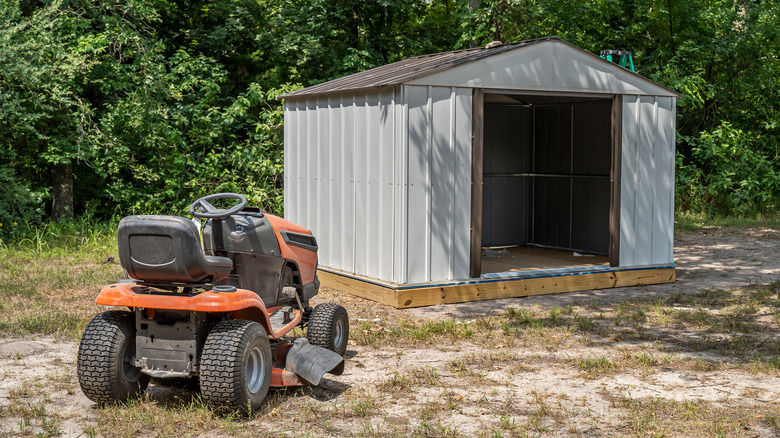 mower outside storage shed