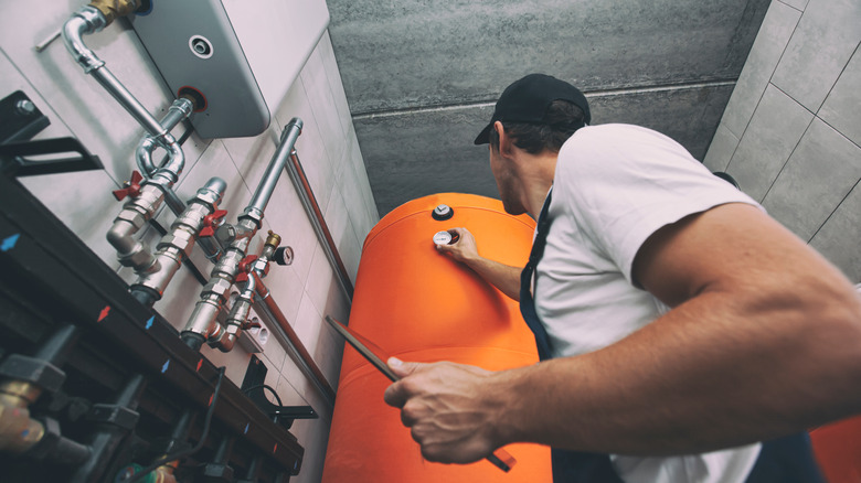 man working on water heater