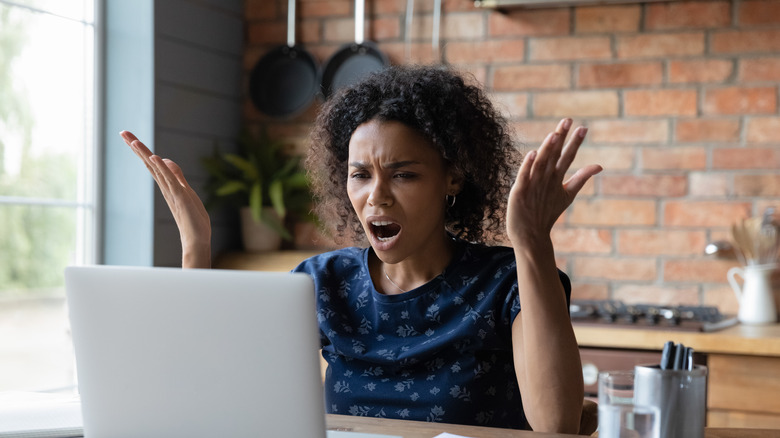 woman distressed by slow internet