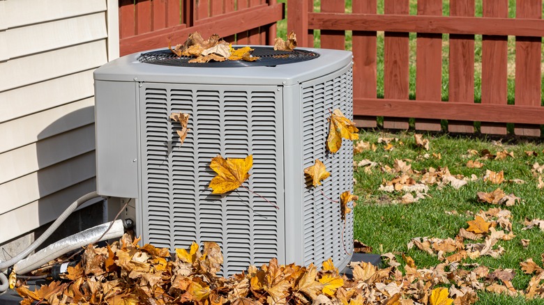 AC unit covered in leaves