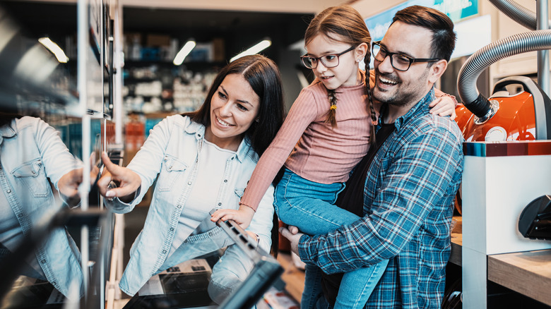 family shopping for new oven