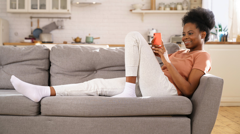 woman on couch in living room