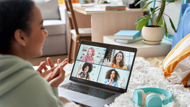 woman video chatting with friends 