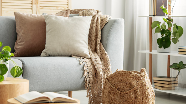 plush gray couch with pillows 