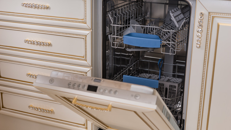 an integrated dishwasher by cabinets