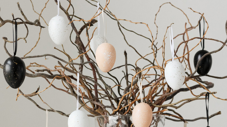 Easter eggs hanging from branches