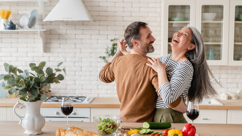 couple dancing in kitchen