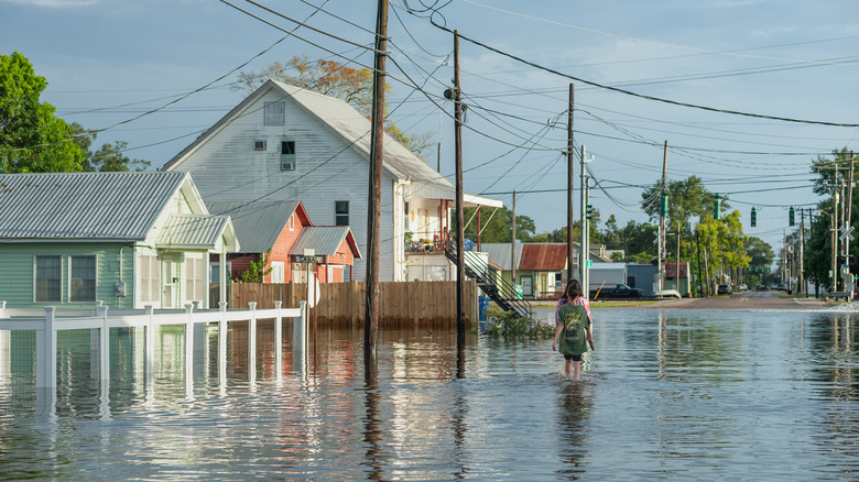 flooded residential street with power lines