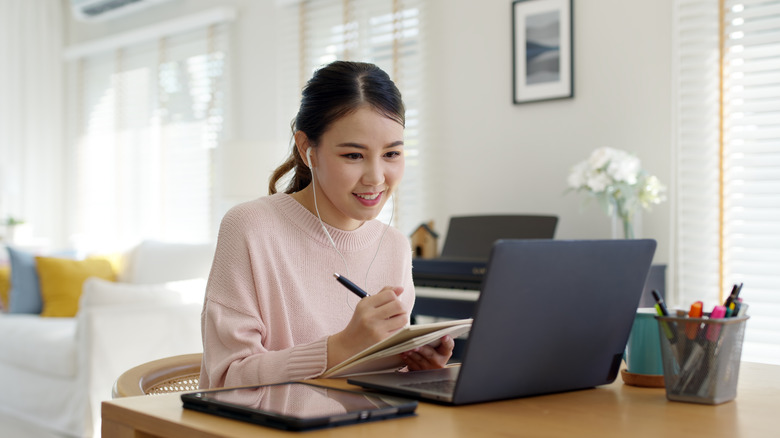 woman smiling on computer