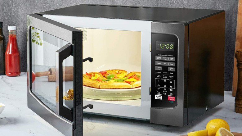 microwave with pizza inside