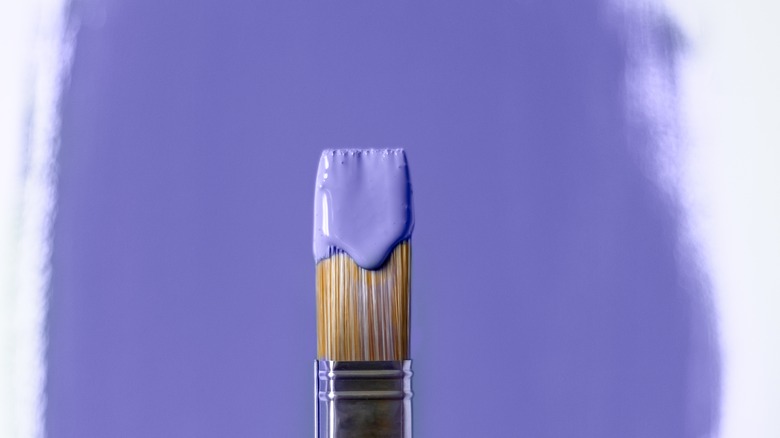 paint brush with purple paint