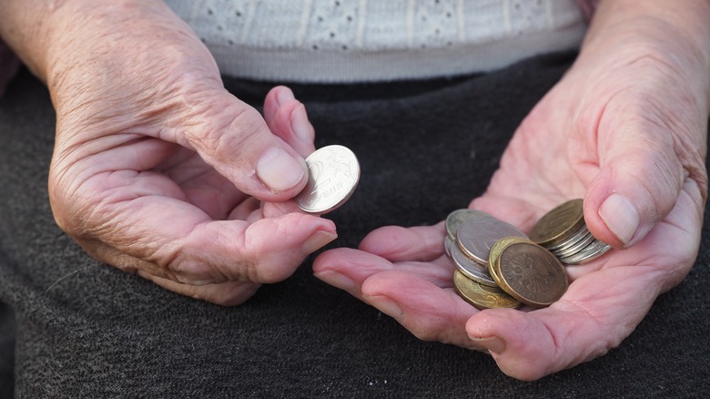 hands holding money