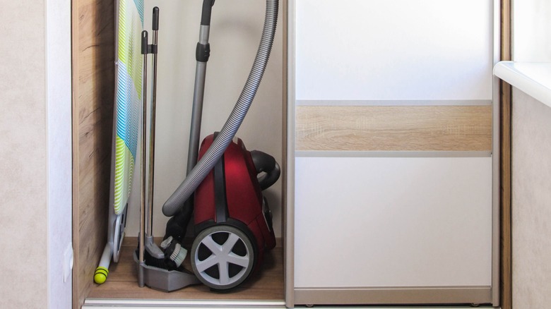 storage closet with vacuum cleaner