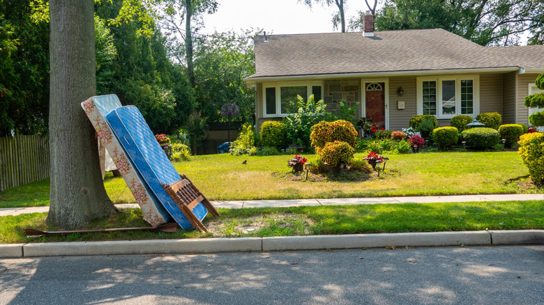 Mattress sitting outside at curb