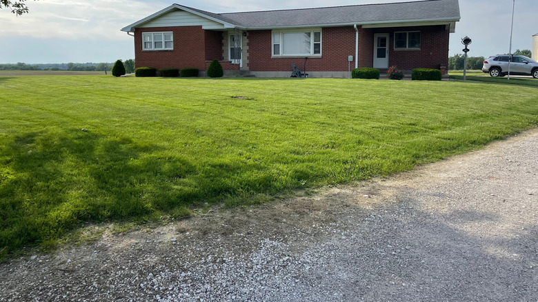 A very thin layer of gravel over a driveway