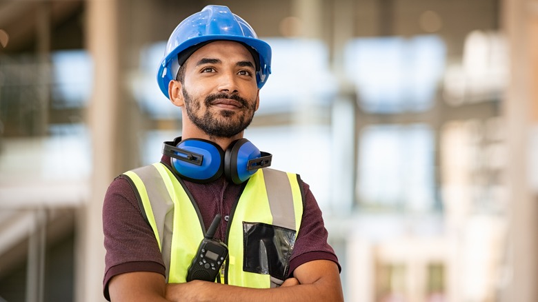 smiling contractor in blue hat