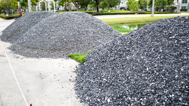 Three piles of gravel on a street