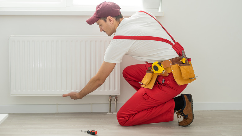 man working on heater