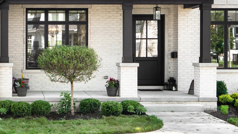 Limewashed front porch with black pillar accent