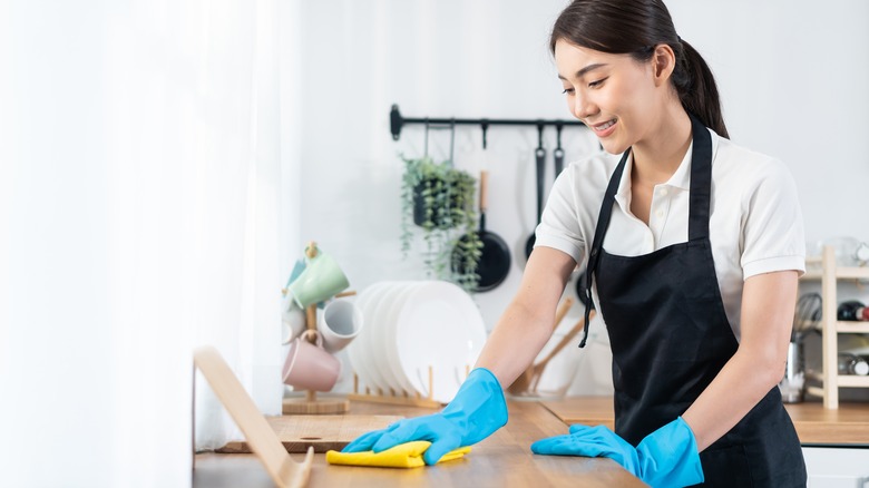 woman cleaning counter 