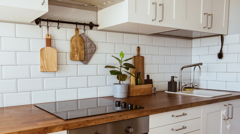 simplistic kitchen with sink and cooktop