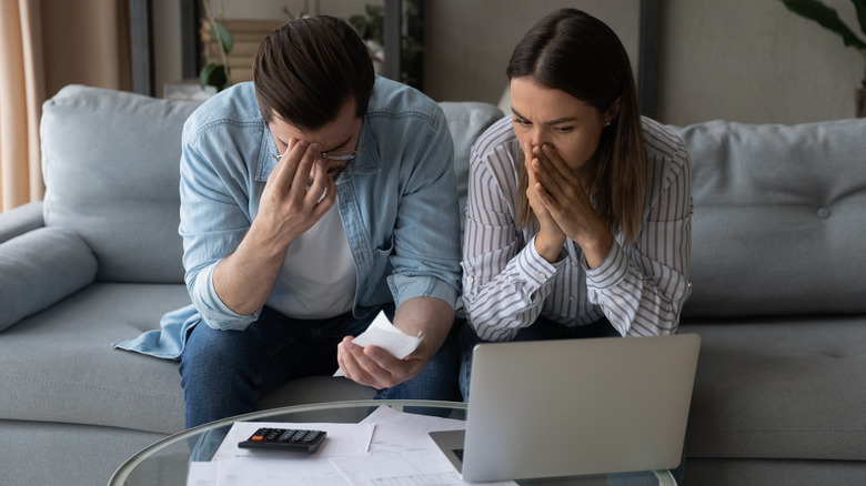 couple looking distraught