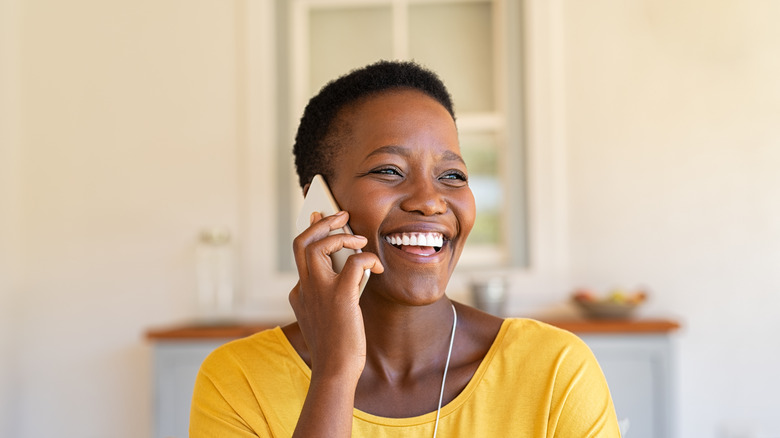 woman smiling on phone
