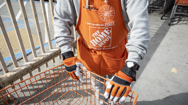 Home Depot employee pushing a cart