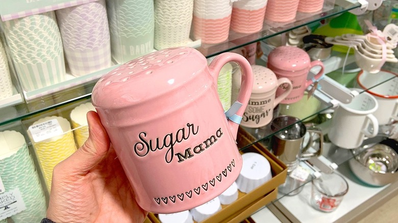 woman holding HomeGoods sugar holder