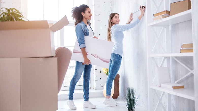 Two girls unpacking and measuring