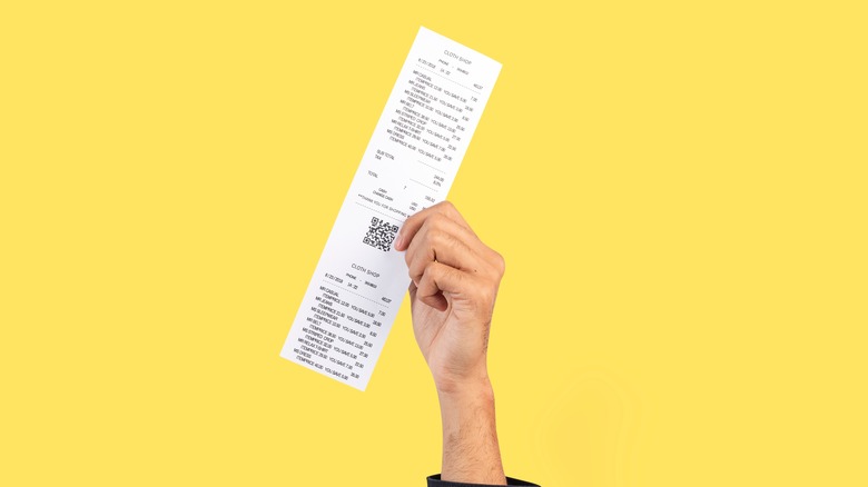 hand holding receipt