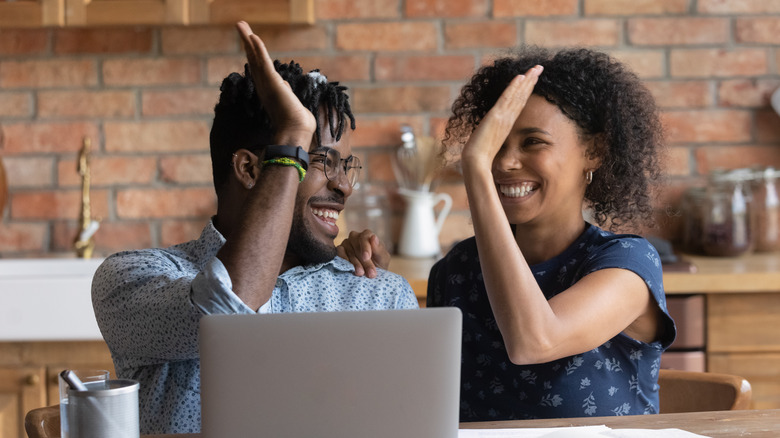 couple excited about online purchase