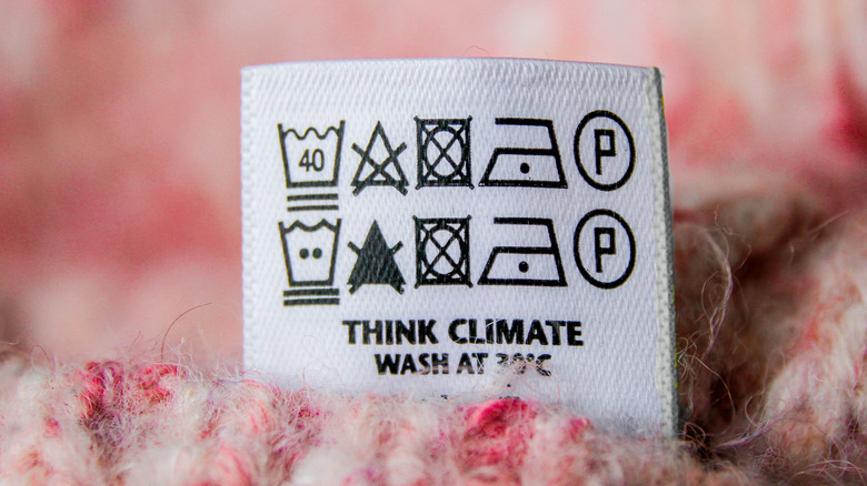 Symbols on a tag on a piece of pink clothing