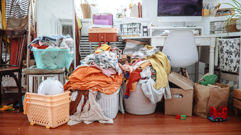 Laundry baskets with laundry in a room