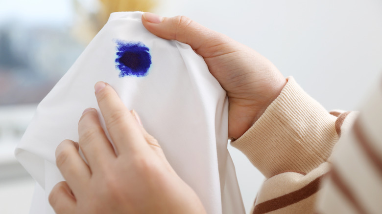 White cloth with blue stain on it