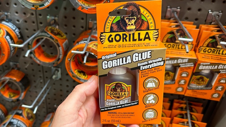 person holding Gorilla Glue bottle