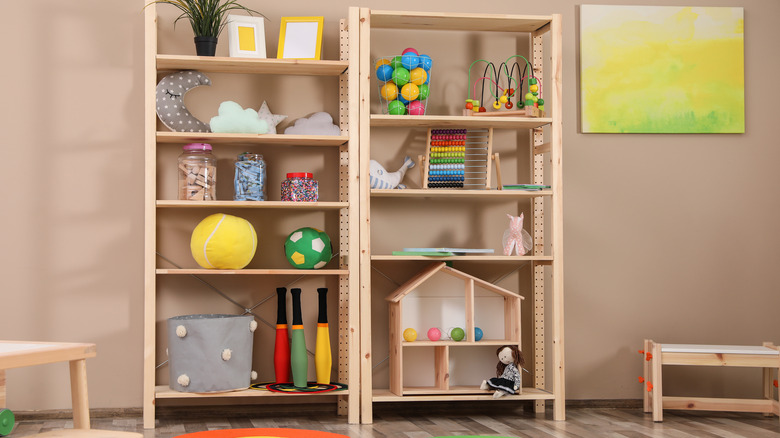 Organized playroom toys on shelving 