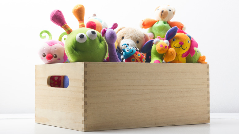 Plush toys in wooden crate